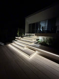Luxe Glow warm white COB LED strip lighting on outdoor deck steps at night